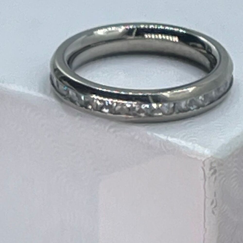 Titanium ring size 5:25 CZ silvertone.